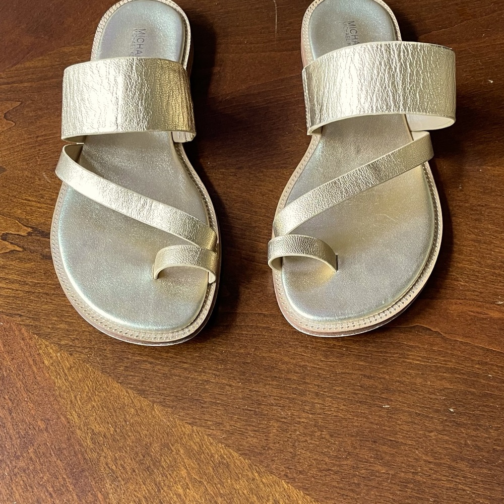 Michael Kors Pratt gold sandal.